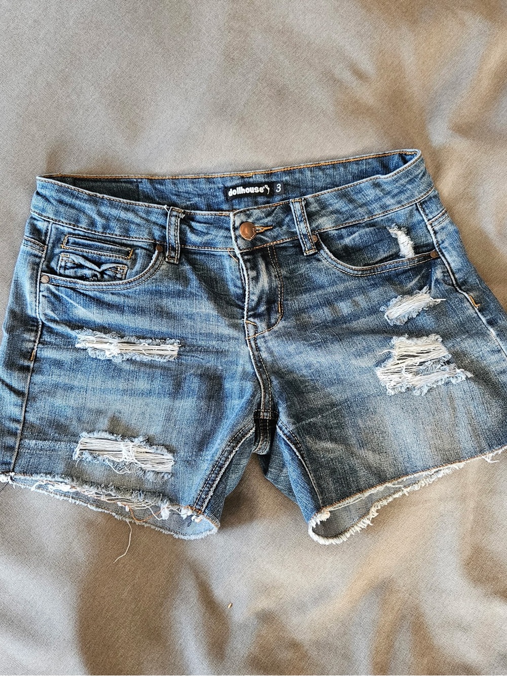 Dollhouse distressed blue denim cut-off shorts